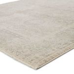 Microscopic view of the rug’s weave displaying varied gray and cream yarns with metallic accents