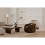 Side view of Thora Lounge Chair showing curved back and rounded seat profile in velvet fabric