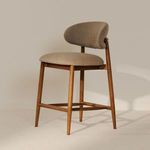 Ellie counter stool styled in neutral room with light carpet and soft natural lighting