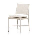 Straight-on view of chair front with cushion placed on woven wicker seat