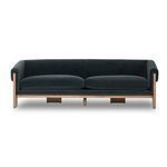 Low angle view of sofa cushions and wide plank wood legs beneath