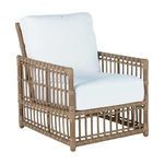 Woven outdoor lounge chair with natural rattan frame and white cushioned back and seat