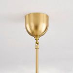 Aged brass ceiling canopy and rod attachment against white ceiling