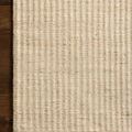 Rug edge flat on wooden floor emphasizing whip-stitched border stitching detail