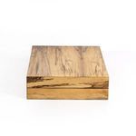 Backgammon board open on circular stone top table with dice positioned for play