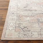 Close-up of the rug’s edge highlighting the woven border and pile density.