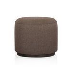 Sinclair Outdoor Ottoman showing slightly raised top curvature from side angle