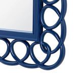 Close-up of the Loop Mirror’s marine blue glossy frame showcasing intertwined loop details and smooth edges