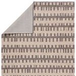 Back of rug showcasing solid gray fabric backing with corner folded over