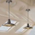 Pair of silver Mariner pendants suspended from ceiling in a modern boat interior with glass roof