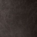 Close-up of black leather grain texture showing natural leather creases