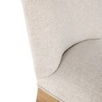 Close-up of Gaston Stool upholstery fabric texture on seat and backrest in slipaway sand color