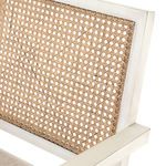 Detailed close view on cane weave pattern texture within chair’s back panel