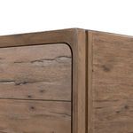 Lower corner close-up showing wood grain pattern and dresser leg detail