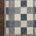 Top view of Rainier rug corner on dark wood flooring showing subtle varied texture within color blocks