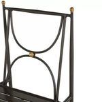 Close-up of chair back's gold knob and circular design detail in slate gray aluminum