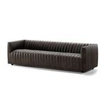Sofa angled from front corner emphasizing soft leather texture and distinct channeling