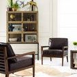 Styled Spencer Curio Cabinet with decorative items including golden giraffe and framed art