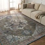 Chaplin rug styled in living room with beige sofa and wooden side table