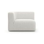 Rhythm sectional side view showing smooth linen upholstery and rounded armrest