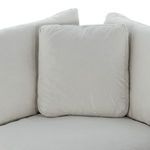 Close-up of corner seat cushion with back pillows inside sectional corner