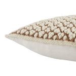 Close-up side angle of boucle textured front meeting smooth fabric back