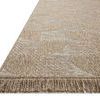 close-up low angle showing fringe detail and woven texture along the edge of the rug