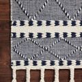 Detailed top view of Sawyer navy rug corner focusing on woven texture and navy cream pattern on hardwood