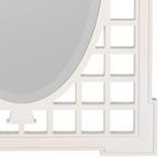 Close-up of lower right corner of lattice frame with glossy white finish and oval mirror edge