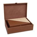 Smaller box nested inside larger box with lid open showing suede interiors