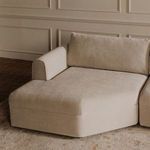 Close-up of chaise area in soft chenille with tonal piping detail and plush removable back pillow