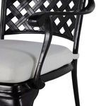 Close-up of curved armrest and edge of white cushion material