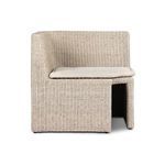 Vintage white outdoor dining banquette with rattan weave and beige fabric cushion, antique-inspired coastal style