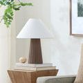 Conju Accent Table Lamp styled on wooden side table in living room with plant and artwork