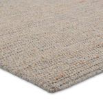 Corner angle showing flat woven striped pattern with natural fiber yarns