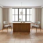 Pair of Ellie Dining Chairs styled beside a wooden dining table in a bright room with large windows