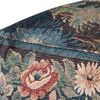 Close-up of the pouf's side showing detailed floral tapestry texture and stitching
