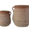 Small Megara urn shown next to a larger urn, highlighting size difference and similar design