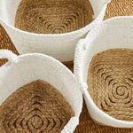Close overhead look at woven bottoms inside Madura Market baskets