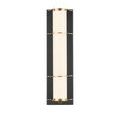 Close detail of rounded brass ring holding opaque glass tube in oil-rubbed bronze base