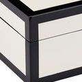 Close-up angled view capturing lacquer sheen on box corners and edges