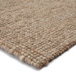 Handwoven Oceana area rug with chunky natural jute and wool yarn in light gray and tan tones