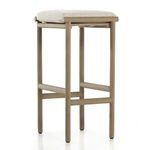 Three-quarter side angle of Kyla stool with cushion showing teak frame joinery