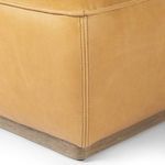 Close-up of corner showing dual-stitched seams and wood grain of parawood base