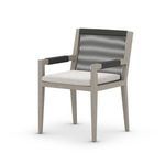 Three-quarter angled front view highlighting rope wrapped armrests and textured cushion fabric
