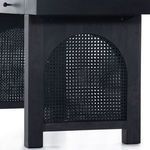 Close-up of woven cane texture on arched panel of Tilda desk leg in black wash