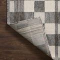 Corner of Rainier Ivory / Pebble Rug flipped to reveal woven backing and underside pattern.