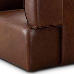 Close-up of front seat base with smooth leather and tight stitching