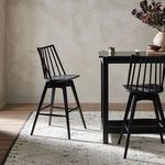 Close-up highlighting the vertical slat spacing and curved top rail of the backrest