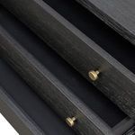 Interior view of open drawers showing black lining and brass hardware mounted on slide rails